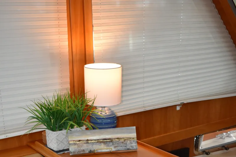 Slide: The Image of Interior of 2011 Sabre 42 Salon Express with lamp and plant decor. - 32