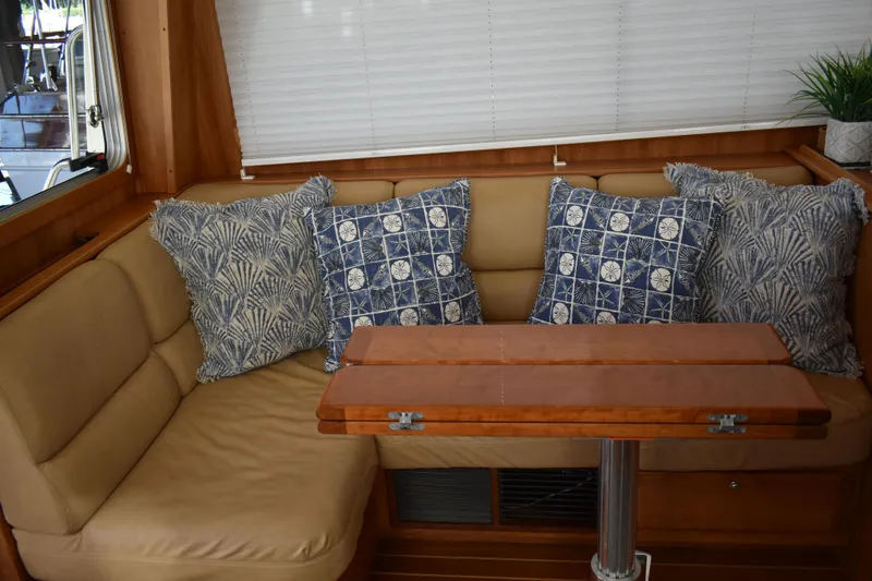 Slide: The Image of Interior of 2011 Sabre 42 Salon Express with cozy seating and decorative pillows. - 33