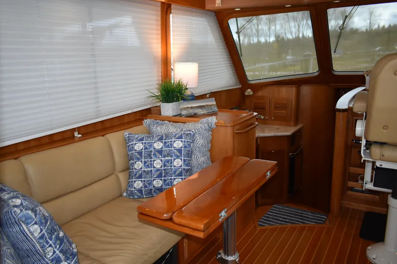 Slide: The Image of Interior of 2011 Sabre 42 Salon Express with cozy seating and nautical decor. - 35