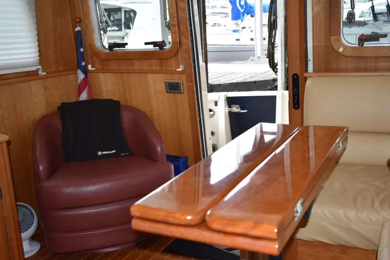 Slide: The Image of Interior of 2011 Sabre 42 Salon Express yacht with wooden table and generous yet comfortable seating. - 38