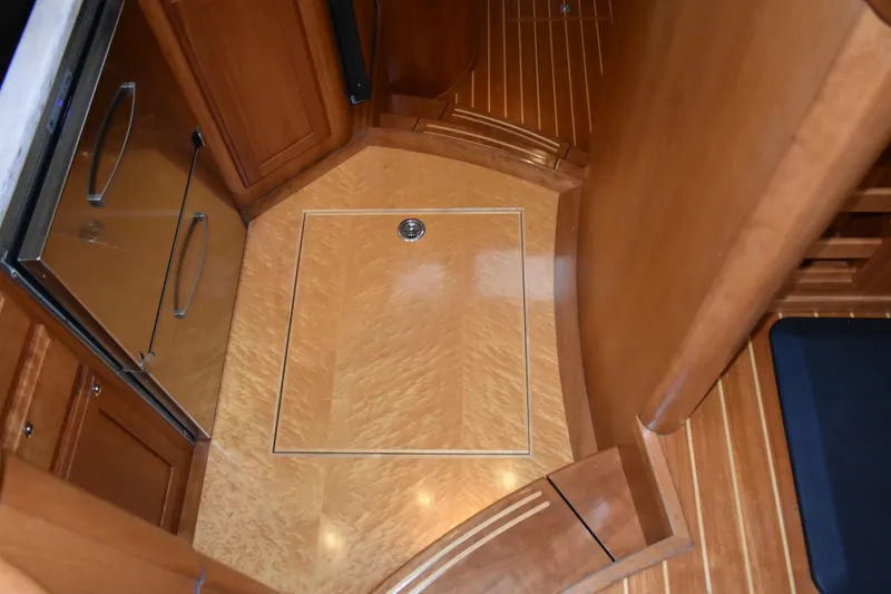 Slide: The Image of 2011 Sabre 42 Salon Express interior with under floor storage and cabinetry. - 42