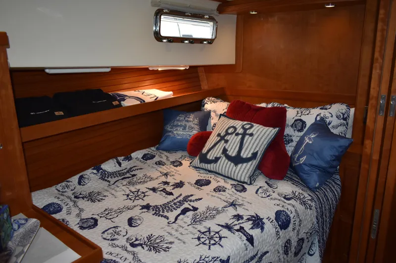 Slide: The Image of Cozy cabin #2 interior of 2011 Sabre 42 Salon Express with nautical-themed bedding. - 48