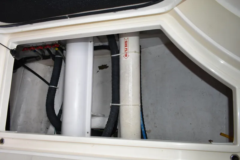 Slide: The Image of Engine compartment of 2011 Sabre 42 Salon Express with visible pipes and wiring. - 5