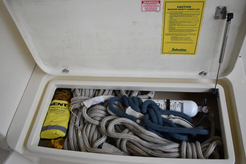 Slide: The Image of Storage compartment on 2011 Sabre 42 Salon Express with ropes and safety equipment. - 6