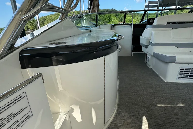Slide: The Image of 2020 Formula 370 SS boat interior with seating and counter, featuring modern design. - 12