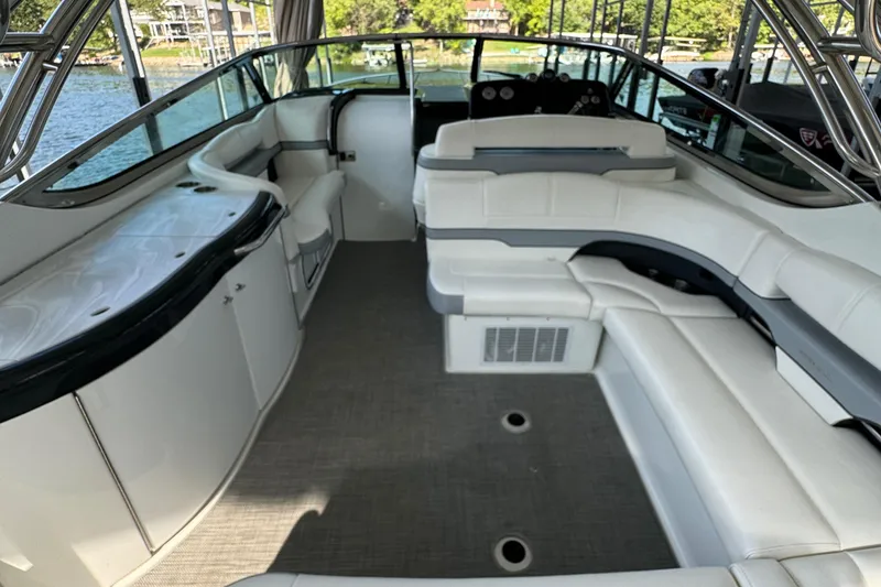 Slide: The Image of 2020 Formula 370 SS boat interior with white seating and sleek design. - 13