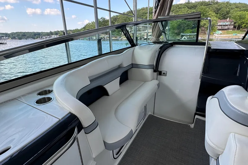 Slide: The Image of 2020 Formula 370 SS boat interior with white seating and lake view. - 20