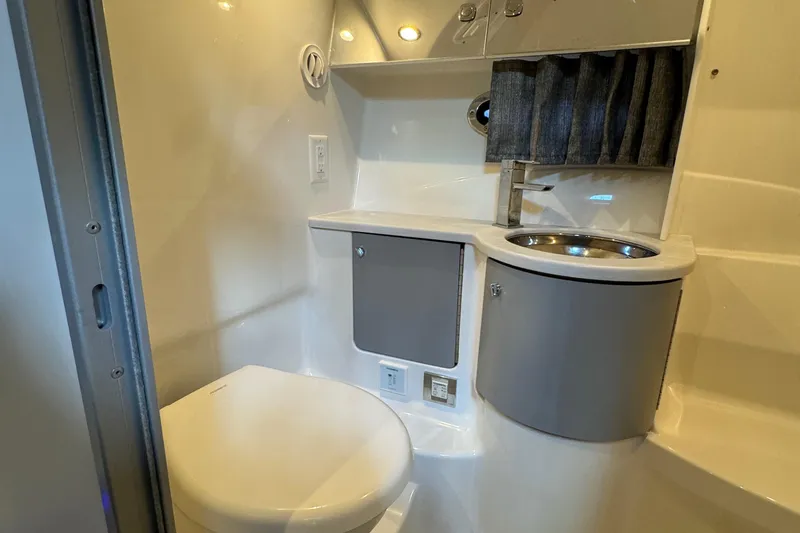 Slide: The Image of 2020 Formula 370 SS bathroom with modern sink, toilet, and storage. - 23