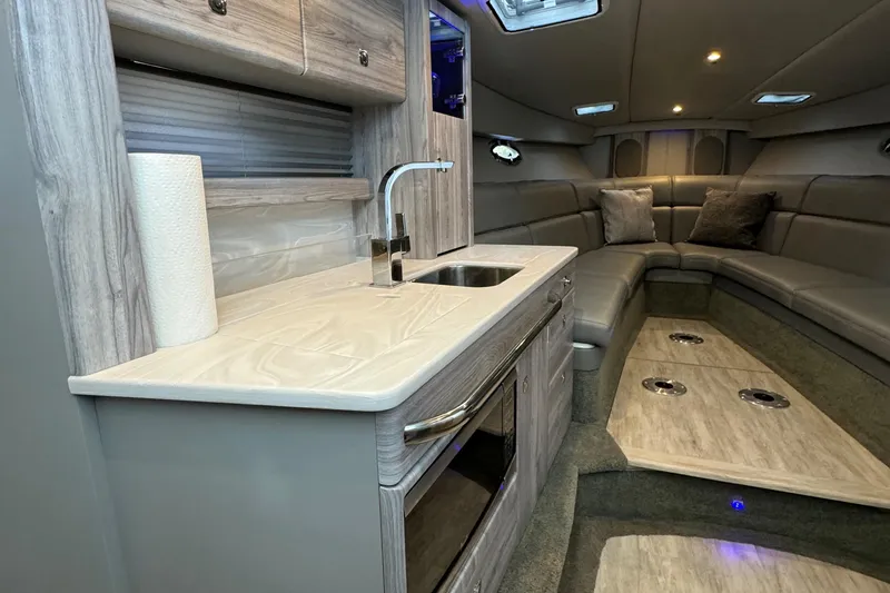 Slide: The Image of Interior of 2020 Formula 370 SS boat with modern kitchen and seating area. - 30