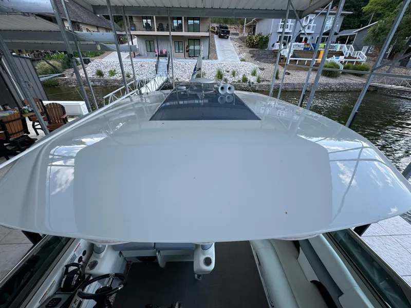 Slide: The Image of 2020 Formula 370 SS boat docked, showcasing sleek design and spacious deck. - 35