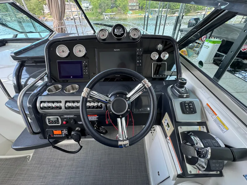 Slide: The Image of Cockpit of 2020 Formula 370 SS boat with steering wheel and control panels. - 4