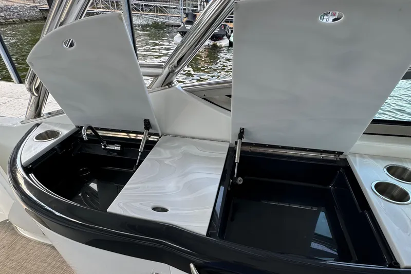 Slide: The Image of 2020 Formula 370 SS boat with open storage compartments and cup holders. - 40