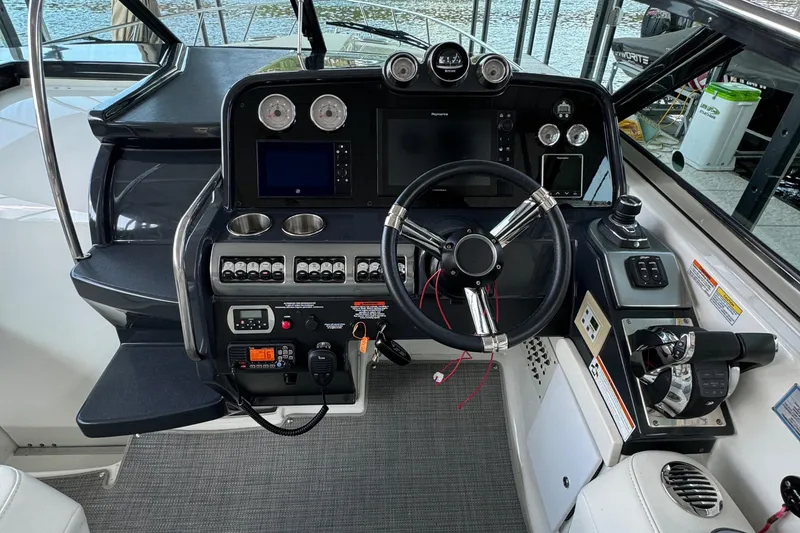 Slide: The Image of Cockpit of a 2020 Formula 370 SS boat with steering wheel and control panels. - 41