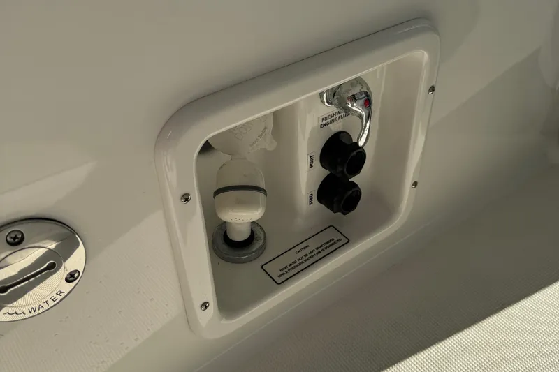 Slide: The Image of 2020 Formula 370 SS boat control panel with water access and switches. - 44