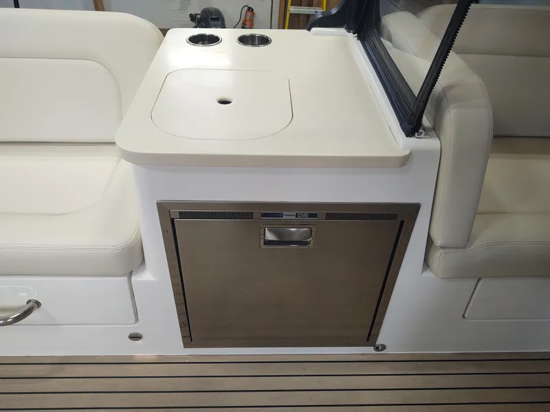 Slide: The Image of Interior of 2022 MJM 3 boat with seating, sink, and built-in refrigerator. - 27