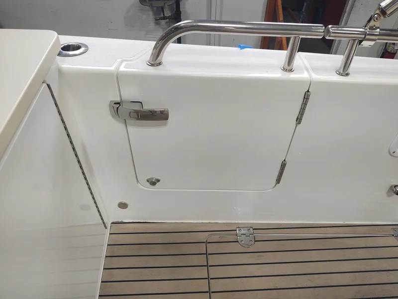 Slide: The Image of MJM 3 2022 boat deck with white hatch and stainless steel railing. - 34