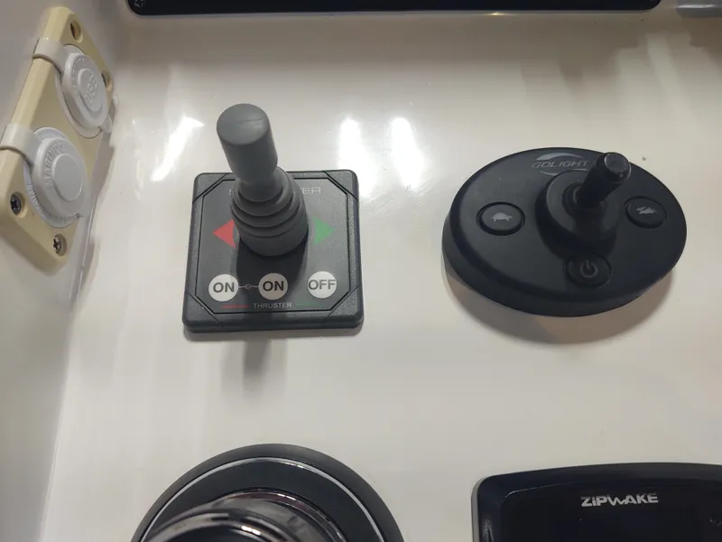 Slide: The Image of Control panel of a 2022 MJM 3 boat with joystick and switches. - 37