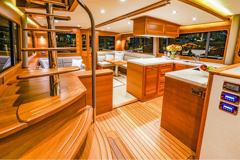 Slide: The Image of Luxurious interior of 2026 Grand Banks GB 60 yacht with elegant wood finishes and modern design. - 10