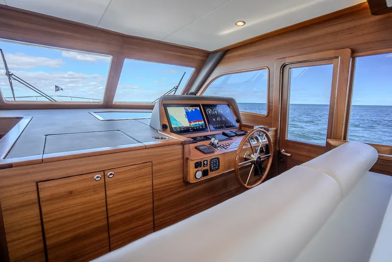Slide: The Image of Luxurious 2026 Grand Banks GB 54 yacht interior with modern navigation system. - 16