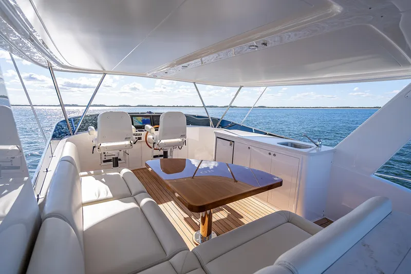 Slide: The Image of Luxurious 2026 Grand Banks GB 54 yacht interior with seating and ocean view. - 27