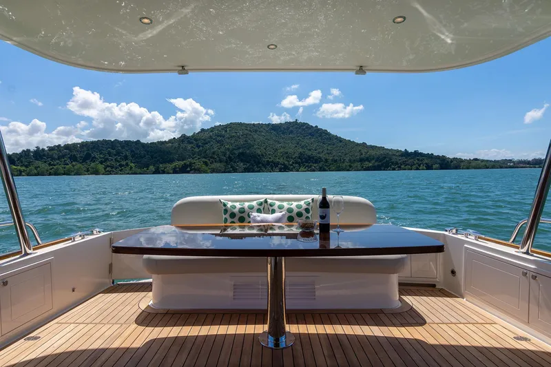 Slide: The Image of Luxury Grand Banks GB 54 yacht deck with scenic ocean view, 2026 model. - 5