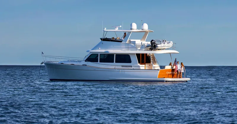Slide: The Image of 2026 Grand Banks GB 54 yacht cruising on open water. - 0