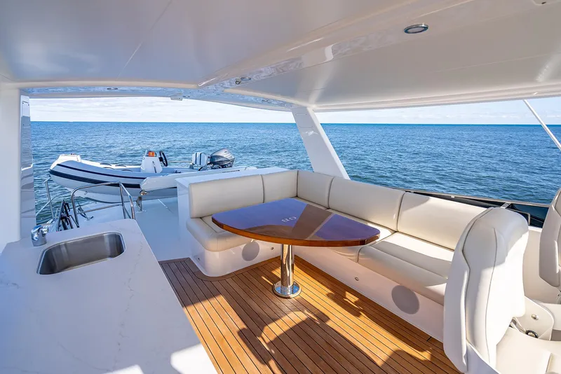 Slide: The Image of Luxury seating area on 2026 Grand Banks GB 54 yacht with ocean view. - 17