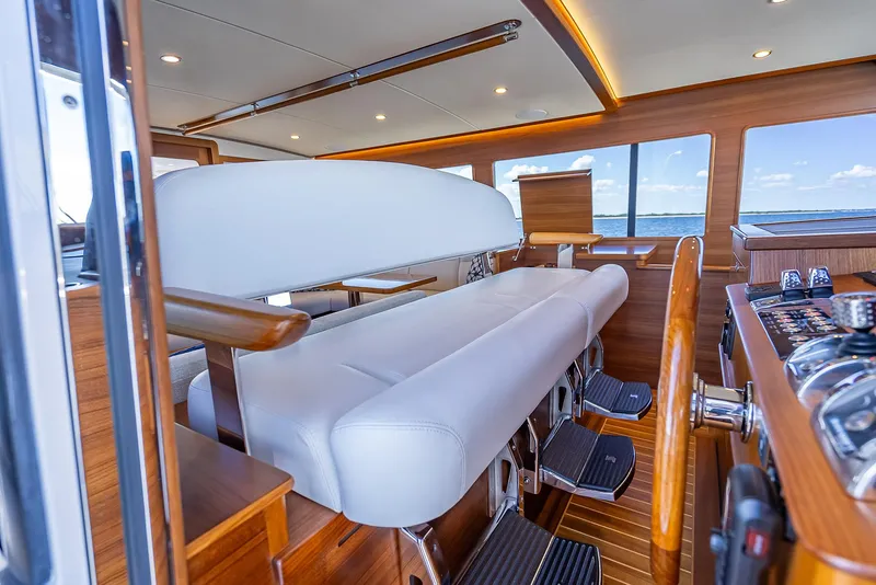 Slide: The Image of Interior of 2026 Grand Banks GB 54 yacht with luxurious seating and modern design. - 23