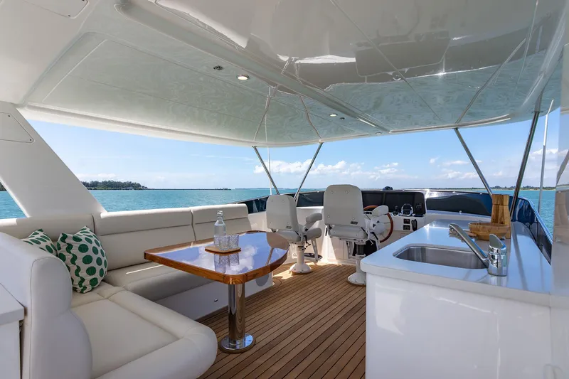 Slide: The Image of Luxurious 2026 Grand Banks GB 54 yacht interior with seating, table, and ocean view. - 34
