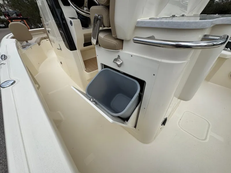 Slide: The Image of 2025 Scout 261 XSS boat interior with built-in storage compartment. - 10