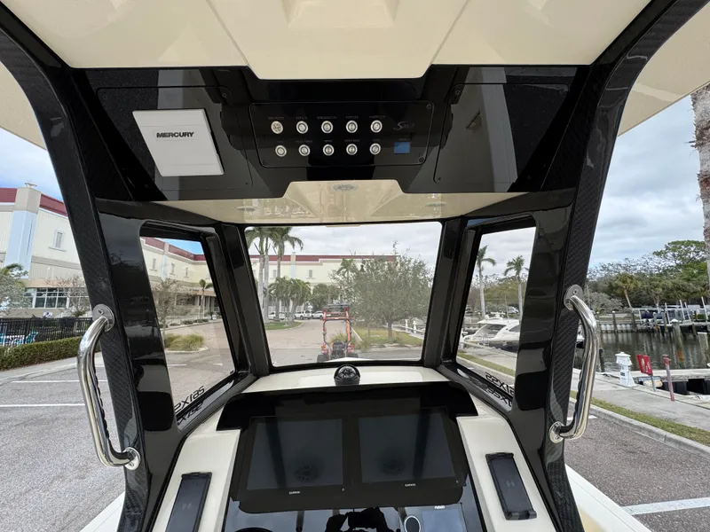 Slide: The Image of 2025 Scout 261 XSS boat dashboard with modern controls and navigation screens. - 4