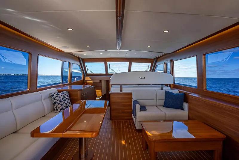 Slide: The Image of Luxurious interior of 2026 Grand Banks GB 54 yacht with elegant wood finishes and ocean view. - 10