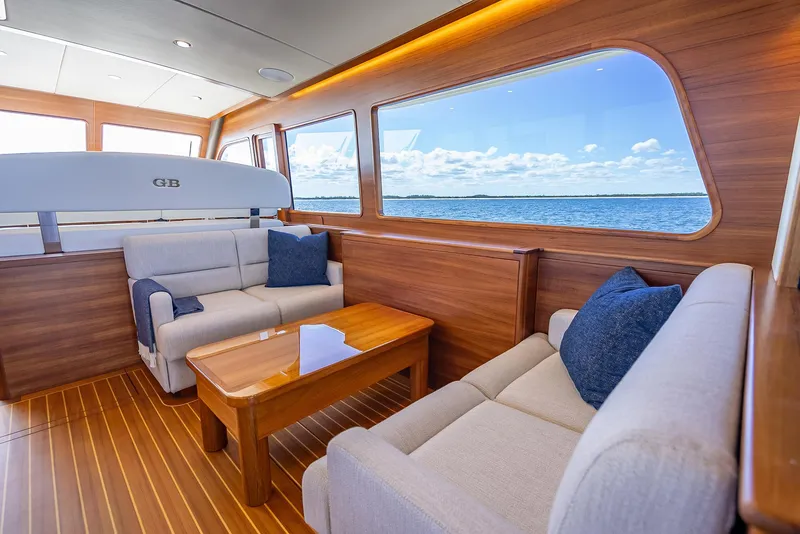 Slide: The Image of Luxurious interior of 2026 Grand Banks GB 54 yacht with ocean view. - 13