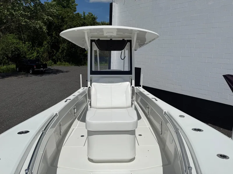 Slide: The Image of 2026 Pair Customs 28 boat with sleek white seating and modern design. - 11