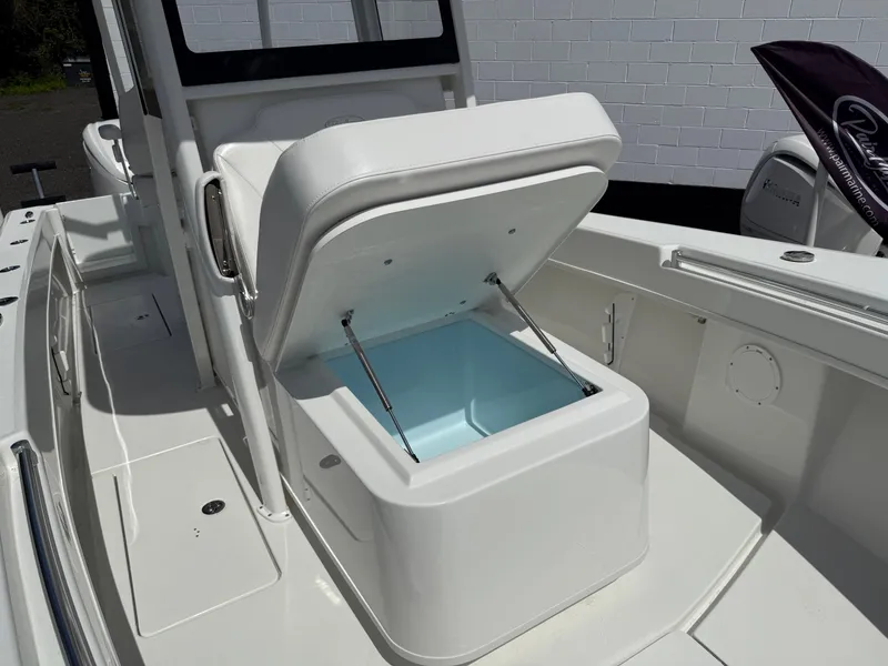 Slide: The Image of Open storage compartment on a 2026 Pair Customs 28 boat, showcasing interior space. - 13
