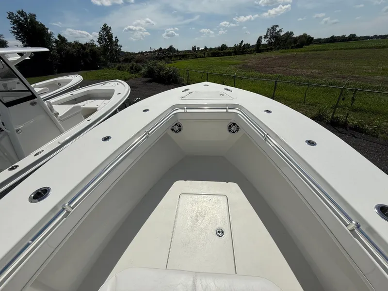 Slide: The Image of Bow view of 2026 Pair Customs 28 boat, featuring sleek design and spacious deck. - 14