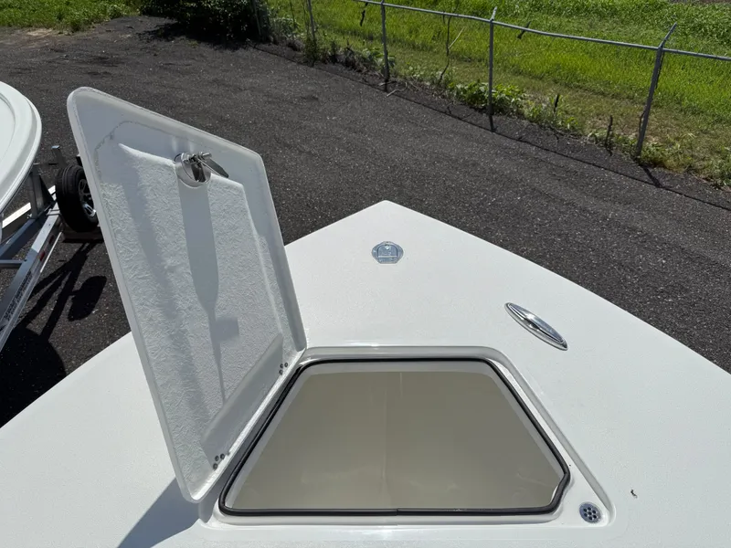 Slide: The Image of Open hatch on 2026 Pair Customs 28 boat, showing interior compartment. - 15