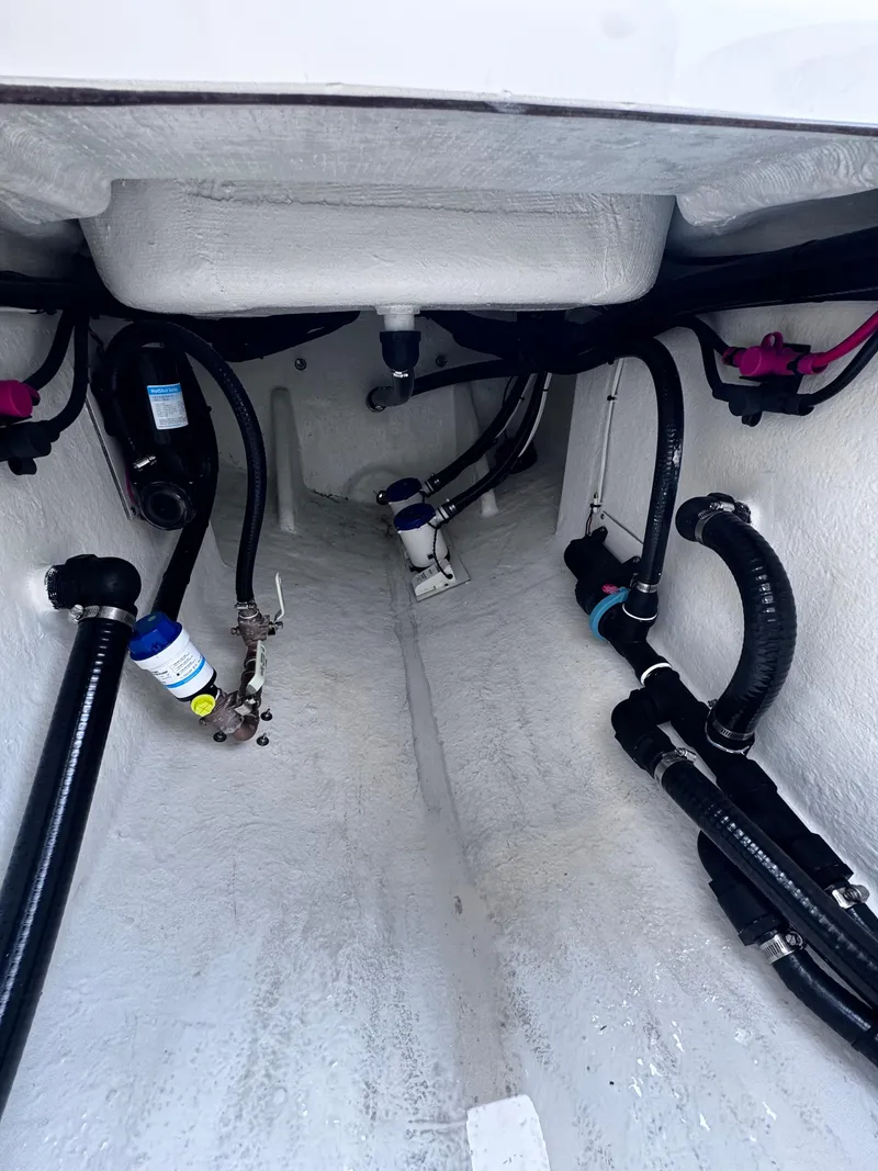 Slide: The Image of Interior view of a 2026 Pair Customs 28 boat, showcasing plumbing and wiring. - 17