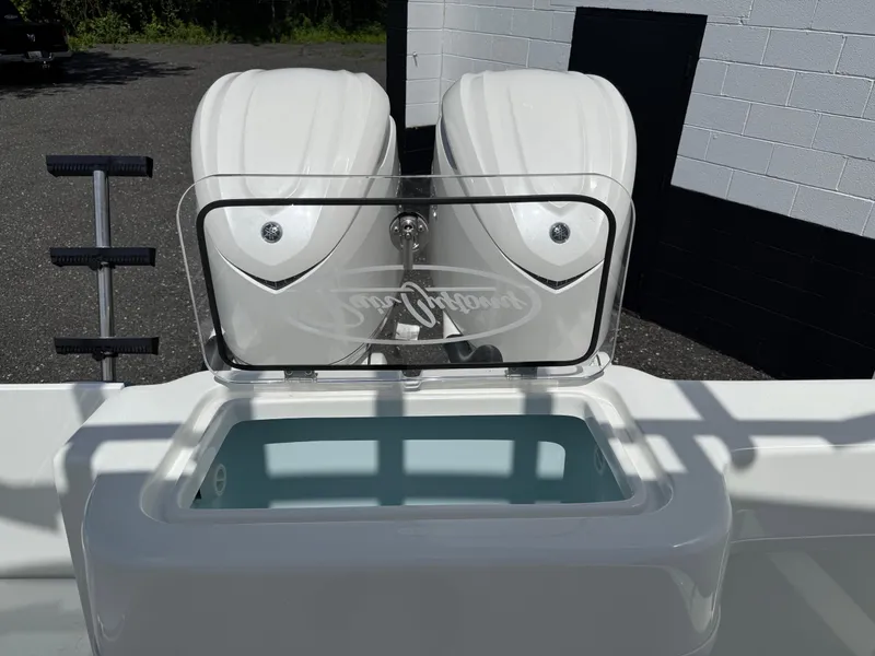 Slide: The Image of 2026 Pair Customs 28 boat with dual engines and open storage compartment. - 8
