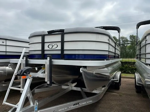 Slide: The Image of 2025 Veranda Vista Sport VS 22 RC pontoon boat on trailer, overcast sky. - 0