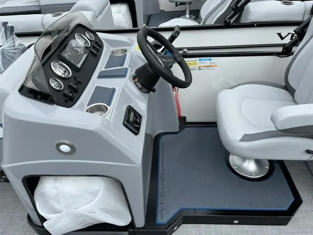 Slide: The Image of 2025 Veranda Vista Sport VS 22 RC boat dashboard with steering wheel and gauges. - 10