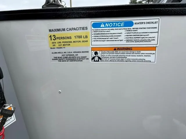 Slide: The Image of 2025 Veranda Vista Sport VS 22 RC capacity and safety labels, 13-person limit, 1780 lbs maximum. - 11
