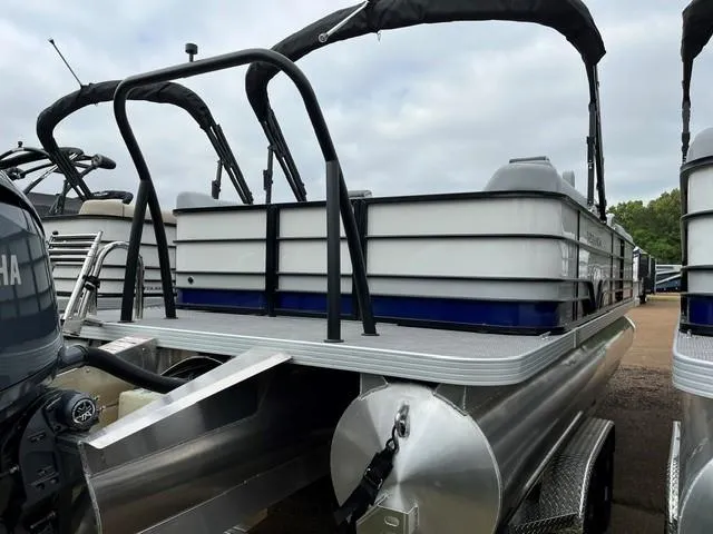 Slide: The Image of 2025 Veranda Vista Sport VS 22 RC pontoon boat, rear view, docked outdoors. - 2