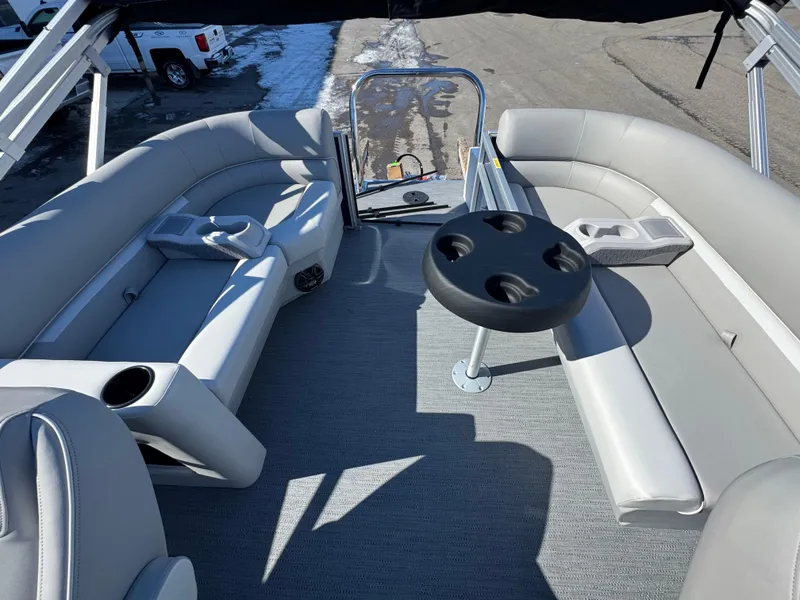 Slide: The Image of 2025 Xperience 2286 SBX pontoon boat interior with gray seating and cup holders. - 12