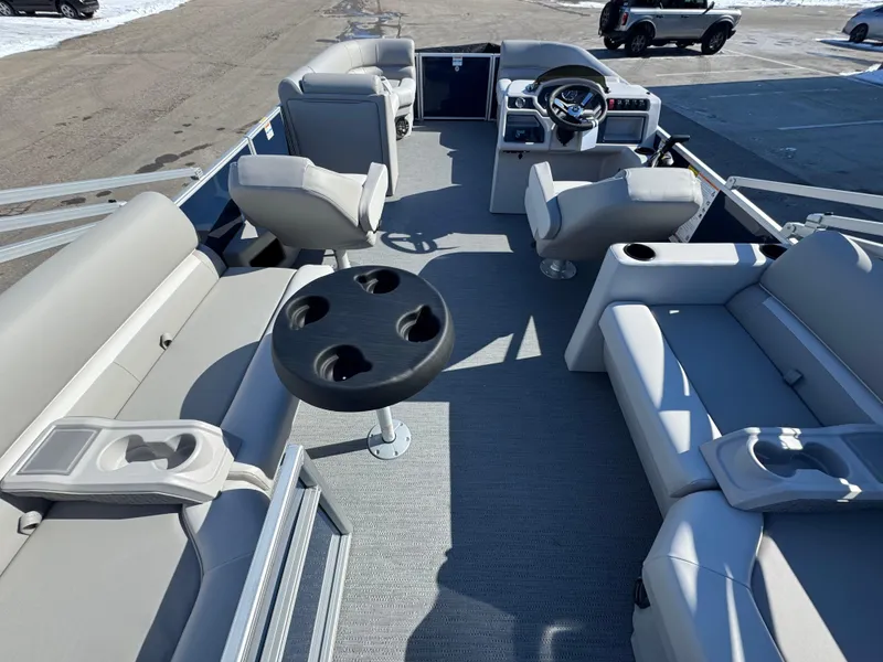 Slide: The Image of 2025 Xperience 2286 SBX pontoon boat interior with seating and steering console. - 3
