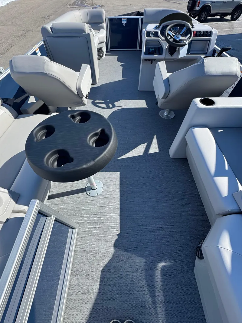 Slide: The Image of 2025 Xperience 2286 SBX boat interior with seating and table, showcasing modern design. - 4