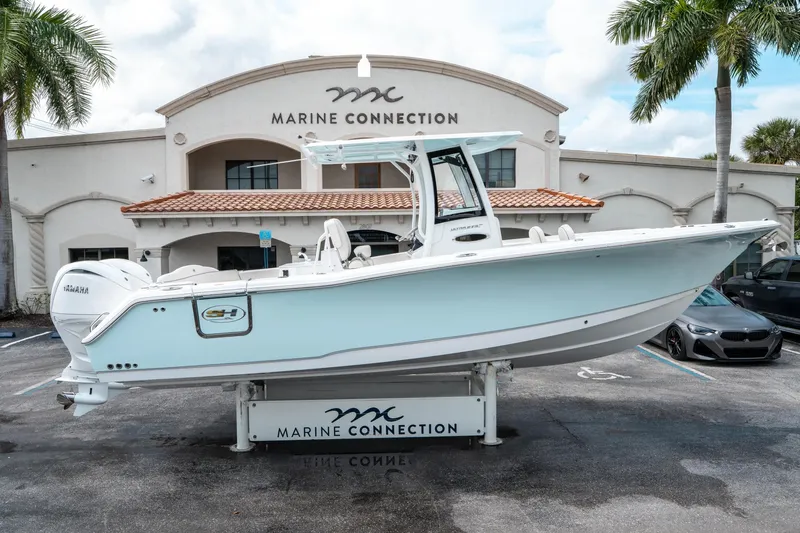 Slide: The Image of 2025 Sea Hunt Ultra 275 SE boat displayed at Marine Connection dealership. - 1