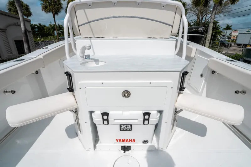 Slide: The Image of 2025 Sea Hunt Ultra 275 SE boat interior with seating and storage. - 16