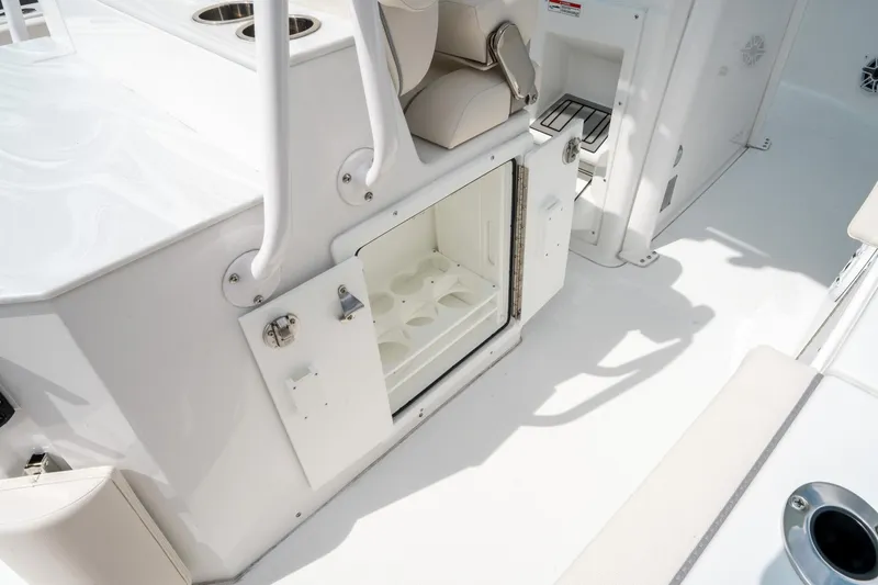 Slide: The Image of 2025 Sea Hunt Ultra 275 SE boat interior with open storage compartment. - 17