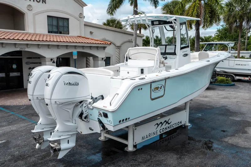 Slide: The Image of 2025 Sea Hunt Ultra 275 SE boat with twin Yamaha engines at Marine Connection. - 2